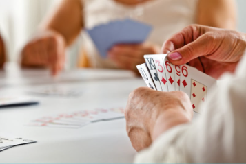 hands playing Eurche