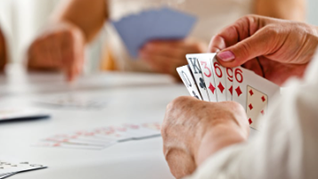 Euchre cards in hands