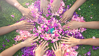 Widow Hands in flowers and grass
